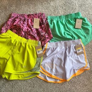 BUNDLE-4 pairs of Nike running shorts. All new with tags. Never worn, size small